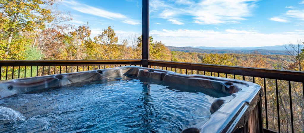 A refreshing hot tub looks over the Blue Ridge Mountains, with beautiful fall colors.